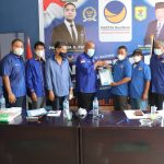 Ketua DPD NasDem Sergai beserta jajaran menyerahkan SK kepada Pengurus DPC pada acara Rakerda I Partai NasDem Sergai Tahun 2022 bertempat di Rumah Besar Partai NasDem Kabupaten Serdang di Sei Bamban, Sabtu (29/1/2022)