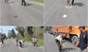 Petugas dari Unit Laka Pos Lantas Sei Bamban melakukan olah TKP ditempat kejadian kecelakaan.