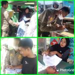 Personil Satpol PP Sergai menyerahkan surat teguran ketiga kepada para pedagang yang berjualan disekitar jalan lintas Galang-Tebingtinggi tepatnya di Pekan Dolok Masihul.