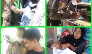 Personil Satpol PP Sergai menyerahkan surat teguran ketiga kepada para pedagang yang berjualan disekitar jalan lintas Galang-Tebingtinggi tepatnya di Pekan Dolok Masihul.