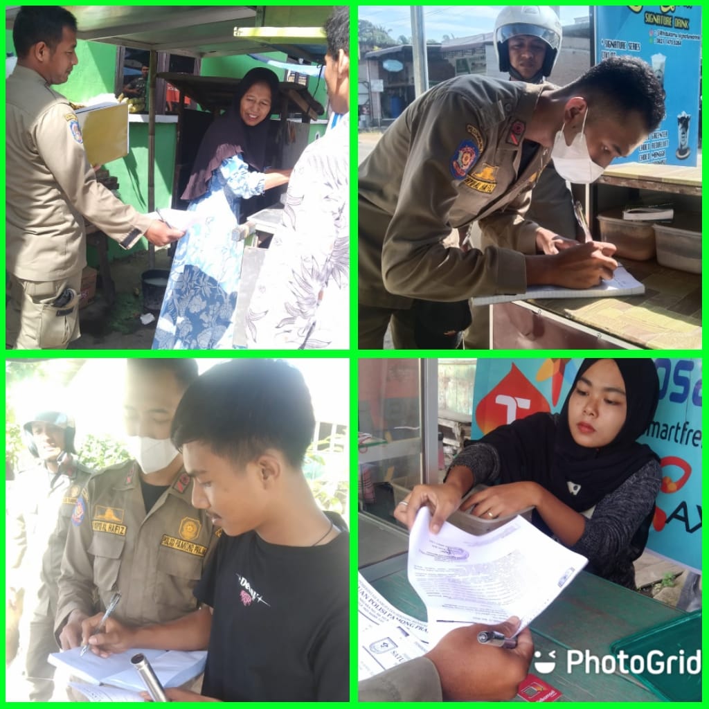 Personil Satpol PP Sergai menyerahkan surat teguran ketiga kepada para pedagang yang berjualan disekitar jalan lintas Galang-Tebingtinggi tepatnya di Pekan Dolok Masihul.